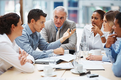 a group of people sitting at a table